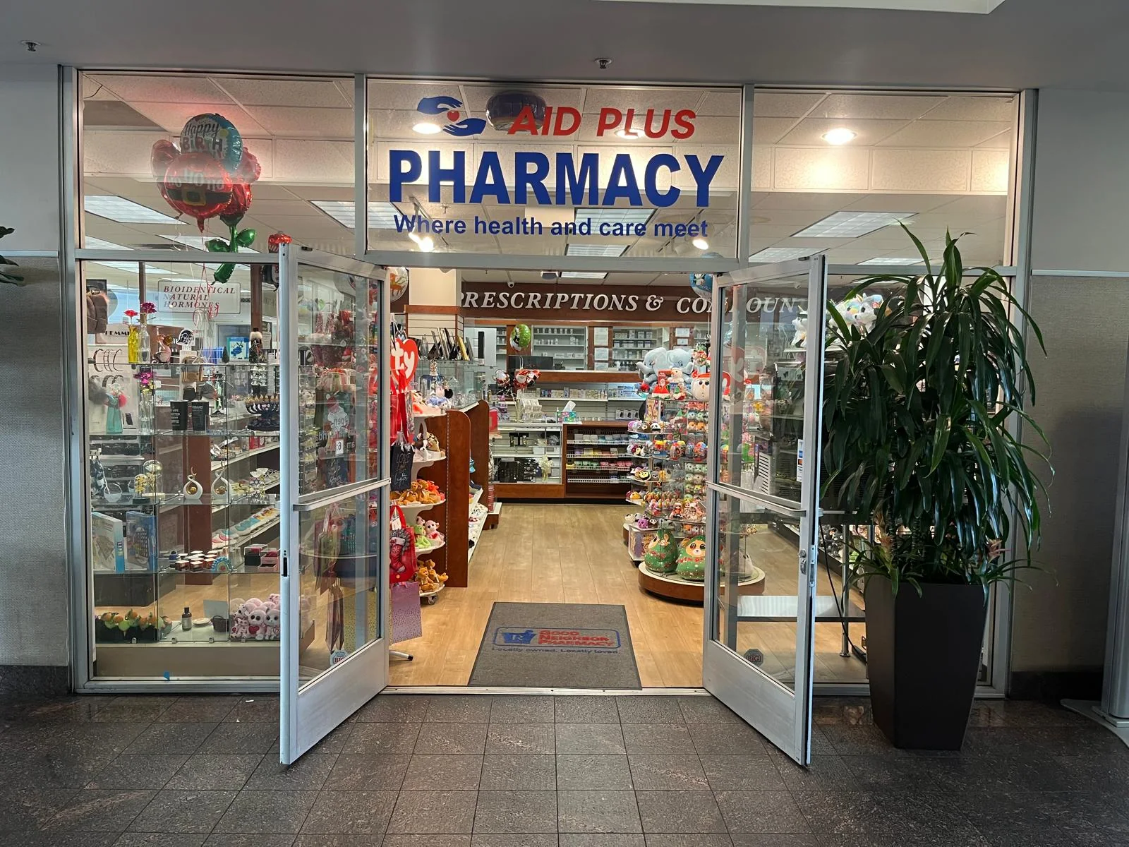 Entrance to Aid Plus Pharmacy